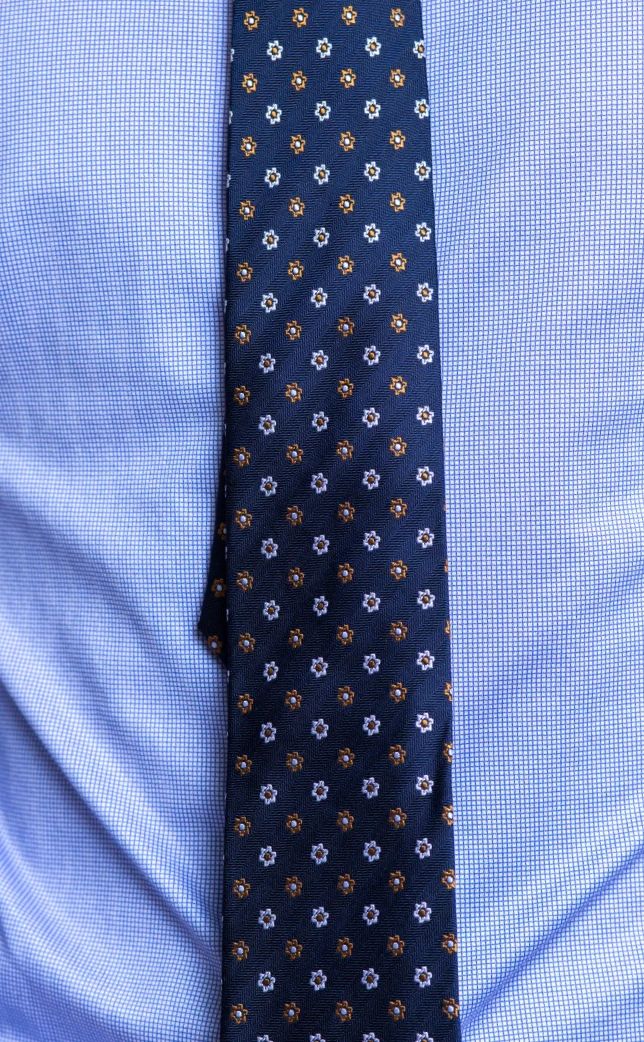 Blue tie over blue shirt