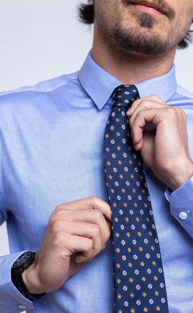 Blue tie over blue shirt