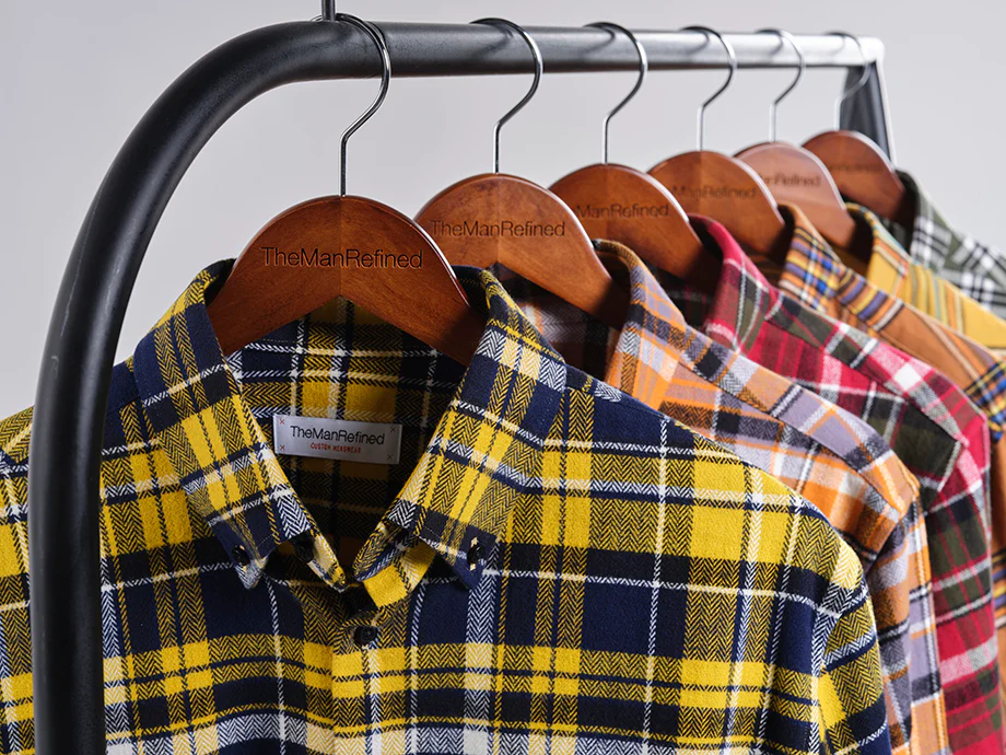 Five Flannel Shirts hanging on a clothes rack